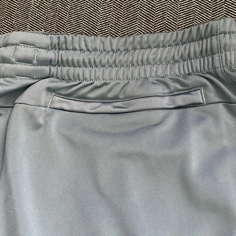 Adidas Men’s Joggers. Blue/grey color with black stripes.